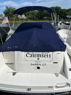 Slide: The Image of 2007 Sea Ray 240 Sundancer boat docked, covered with a blue canopy, in Darien, CT. - 35