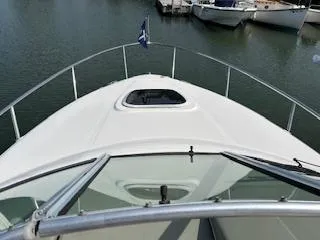 Slide: The Image of 2007 Sea Ray 240 Sundancer boat on calm water, view from bow. - 39