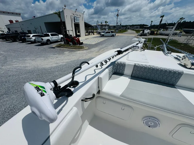 Slide: The Image of 2022 Twin Vee 310 CC GF Classic boat with trolling motor, parked near dealership. - 19