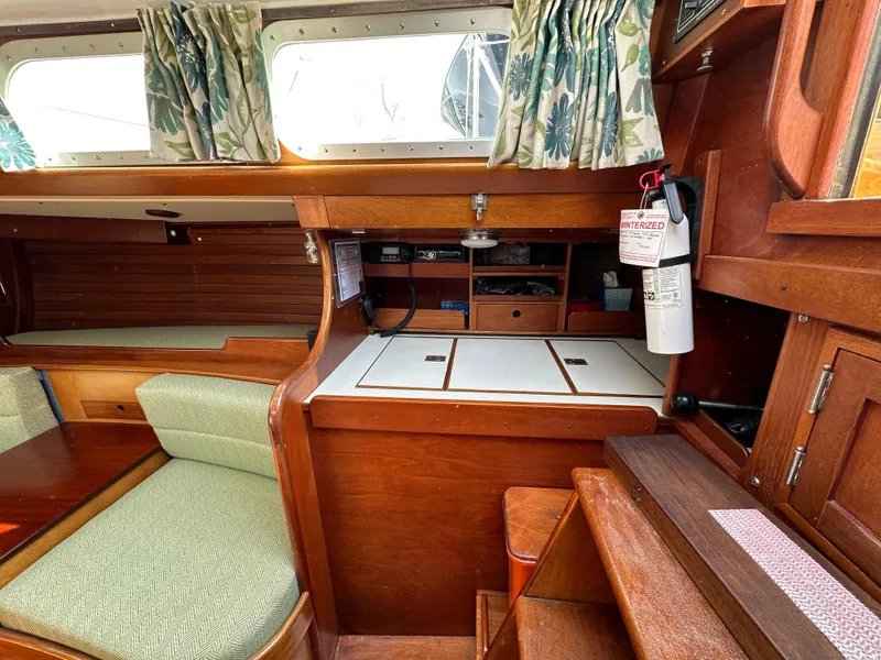 Slide: The Image of Interior of 1978 Hinckley Bermuda 40 MK III sailboat with wood finish and seating area. - 14