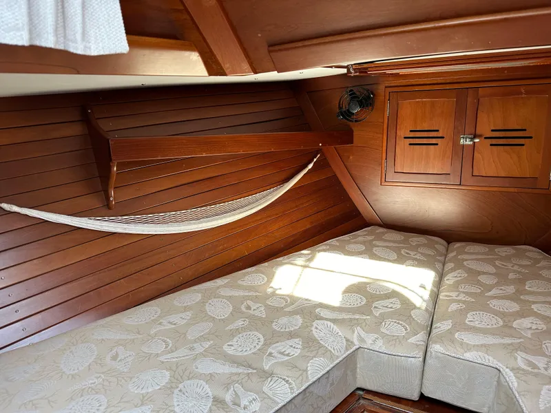 Slide: The Image of Interior of 1978 Hinckley Bermuda 40 MK III with wooden paneling and cushioned seating. - 15