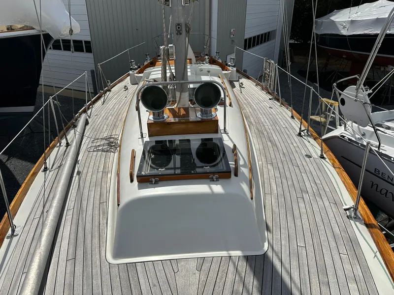 Slide: The Image of 1978 Hinckley Bermuda 40 MK III sailboat deck with wooden accents and rigging. - 20