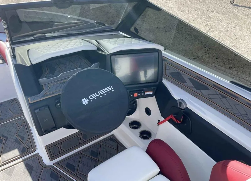 Slide: The Image of 2024 Tigé Z3 boat dashboard with Gussi steering wheel and modern controls. - 4