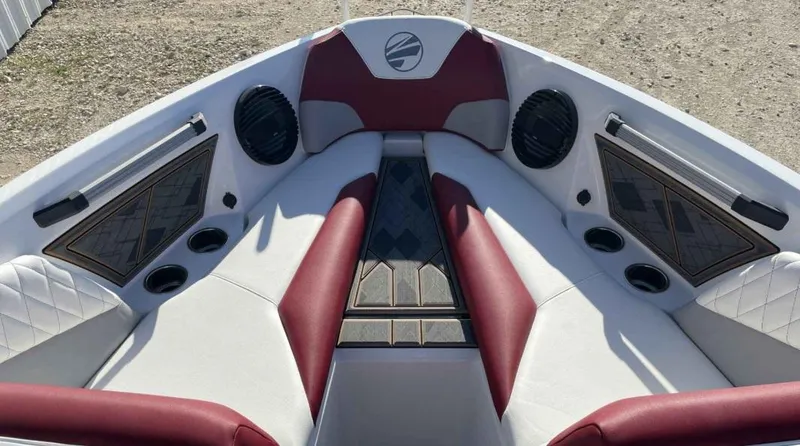 Slide: The Image of 2024 Tigé Z3 boat interior with red and white seating, speakers, and cup holders. - 6