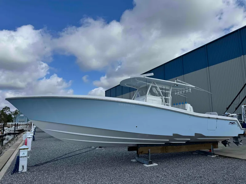 The Image of 2016 Invincible 39' Open Fisherman boat on display under cloudy sky. - 1