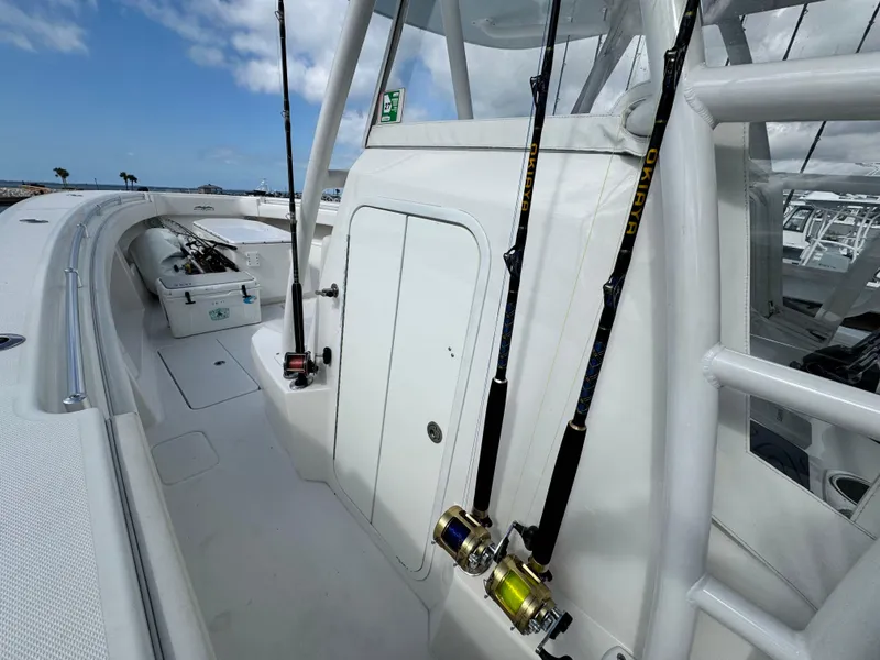 Slide: The Image of 2016 Invincible 39' Open Fisherman boat with fishing rods on deck. - 14