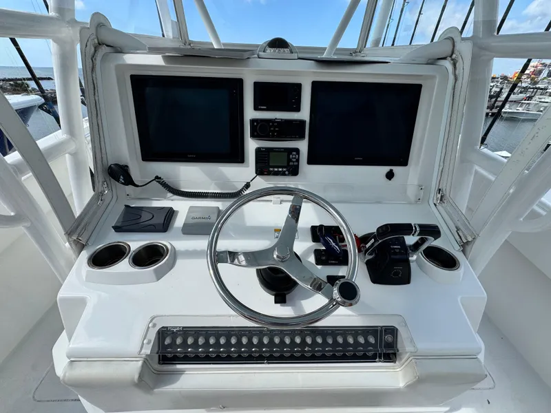 Slide: The Image of 2016 Invincible 39' Open Fisherman helm with dual screens and steering wheel. - 16