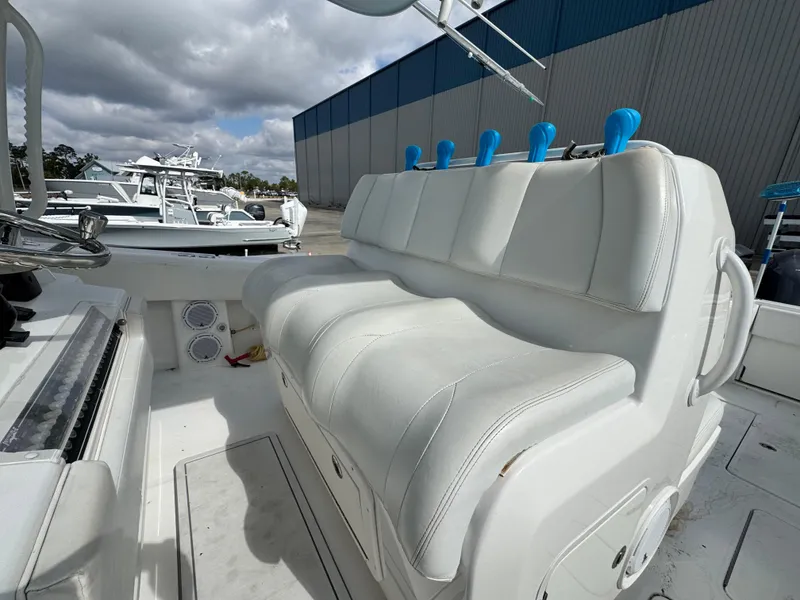 Slide: The Image of 2016 Invincible 39' Open Fisherman boat with white seating and rod holders. - 18