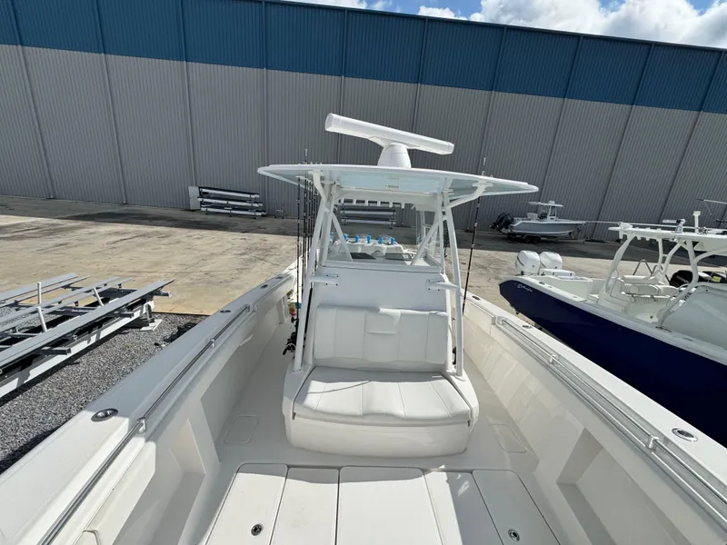 Slide: The Image of 2016 Invincible 39' Open Fisherman boat docked, featuring spacious seating and modern design. - 7