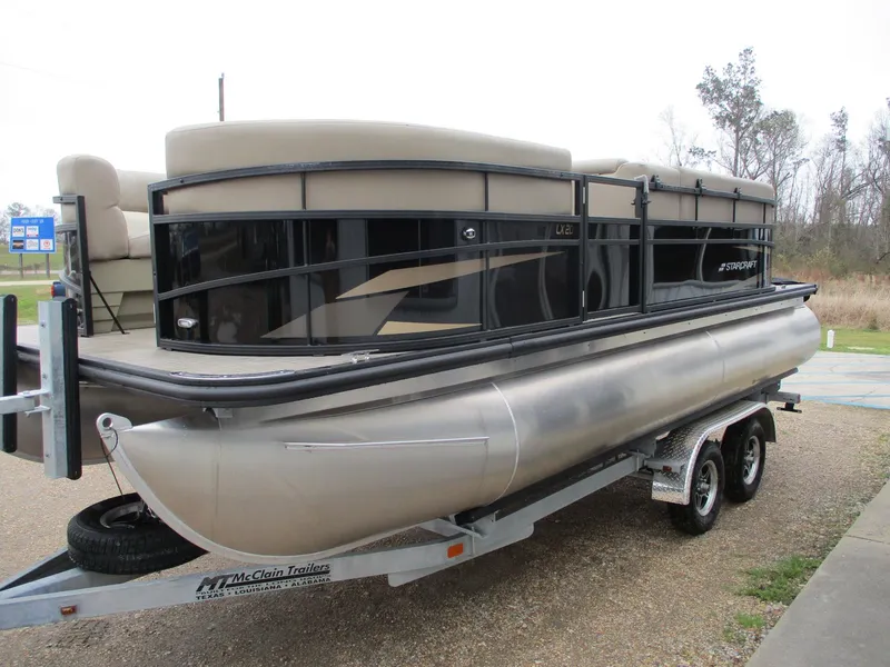 Slide: The Image of 2025 Starcraft LX20 R pontoon boat on trailer, side view. - 3