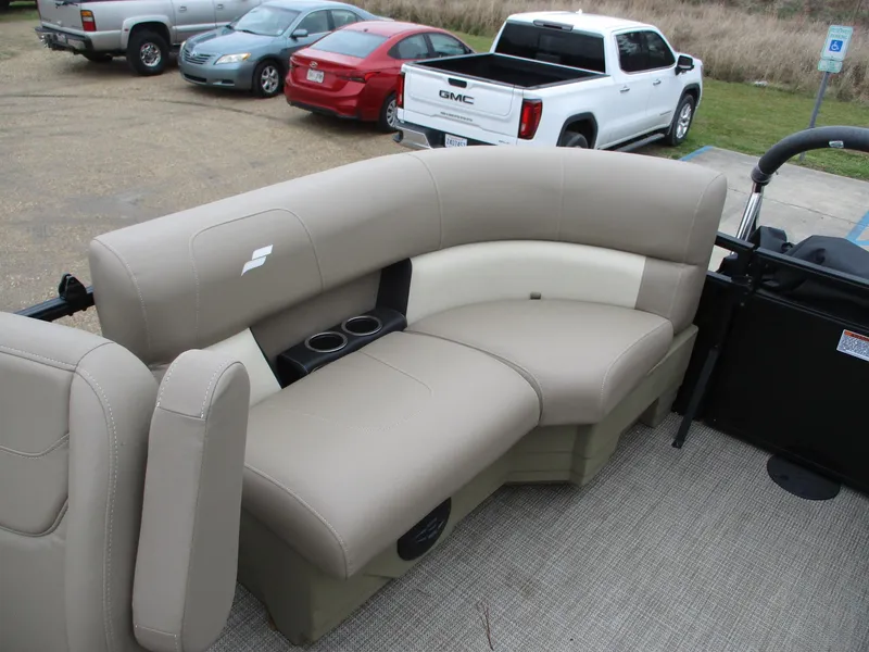 Slide: The Image of 2025 Starcraft LX20 R boat interior with beige seating and cup holders. - 5