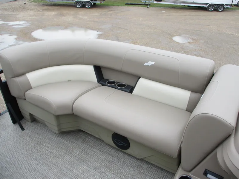 Slide: The Image of 2025 Starcraft LX20 R boat seating with beige upholstery and cup holders. - 7