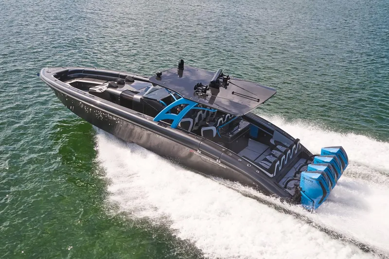 The Image of 2023 Midnight Express 43' Solstice boat cruising on water with powerful engines. - 0