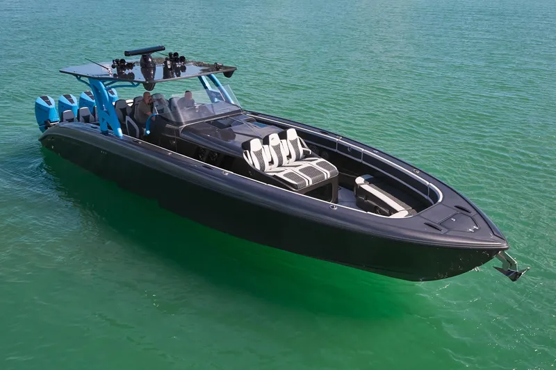 Slide: The Image of 2023 Midnight Express 43' Solstice boat on clear green water. - 10