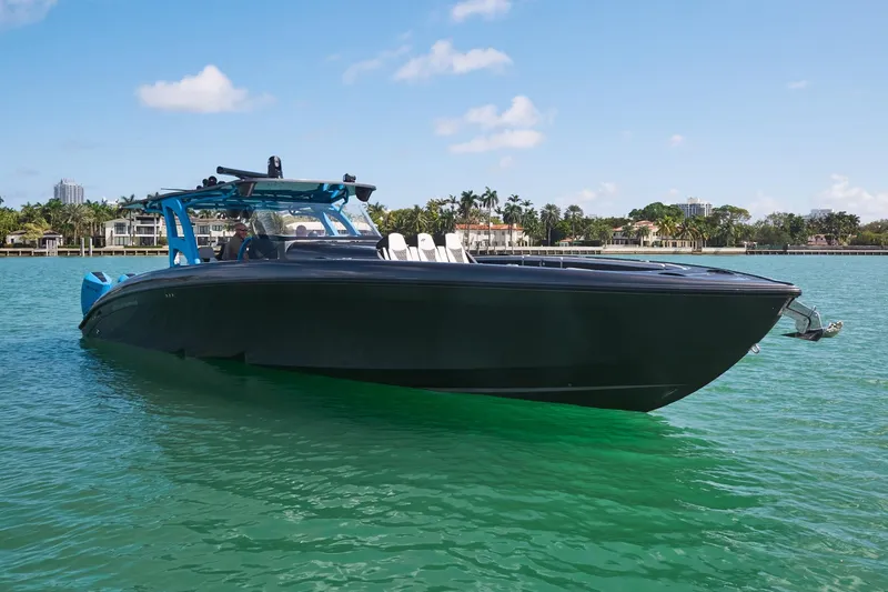 Slide: The Image of 2023 Midnight Express 43' Solstice boat on clear turquoise water. - 11