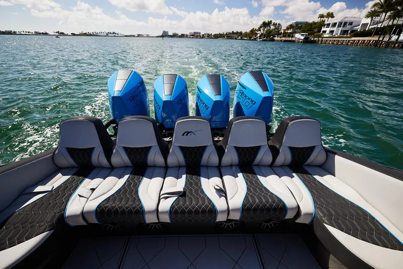 Slide: The Image of 2023 Midnight Express 43' Solstice boat with powerful engines cruising on open water. - 25