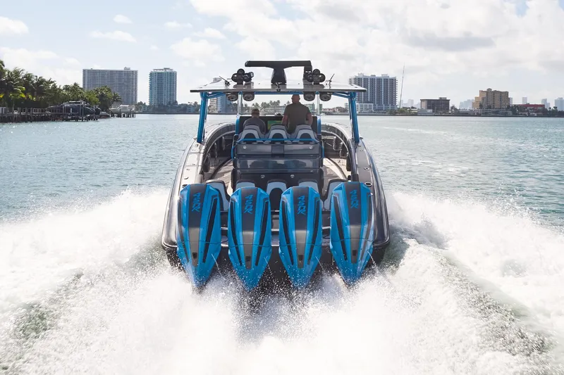 Slide: The Image of 2023 Midnight Express 43' Solstice boat cruising with four powerful engines on a sunny day. - 4