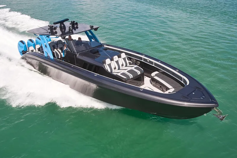 Slide: The Image of 2023 Midnight Express 43' Solstice boat cruising on clear blue water. - 6