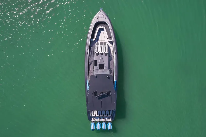 Slide: The Image of Aerial view of 2023 Midnight Express 43' Solstice boat on green water. - 7