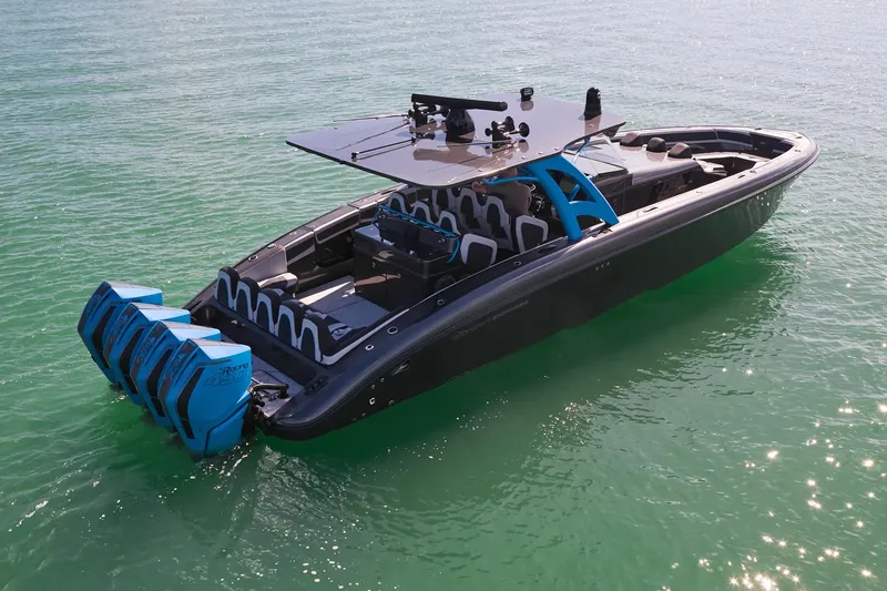 Slide: The Image of 2023 Midnight Express 43' Solstice boat with multiple engines on calm water. - 8