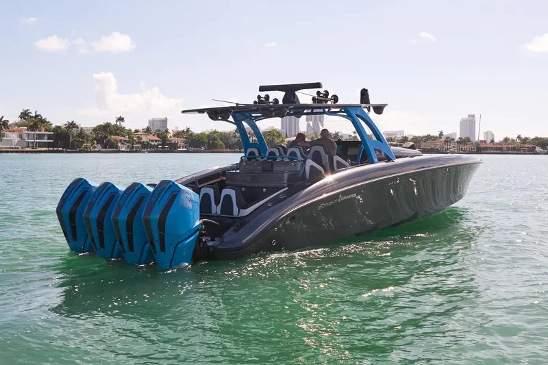 Slide: The Image of 2023 Midnight Express 43' Solstice boat with multiple engines on a sunny day. - 9