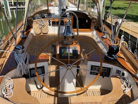 Slide: The Image of Cockpit of 2000 Cherubini Schooner with wooden wheel and navigation instruments. - 19