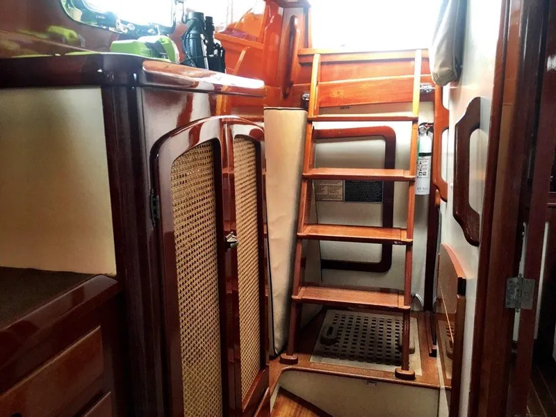Slide: The Image of Interior of 2000 Cherubini Schooner with wooden ladder and cabinetry. - 22
