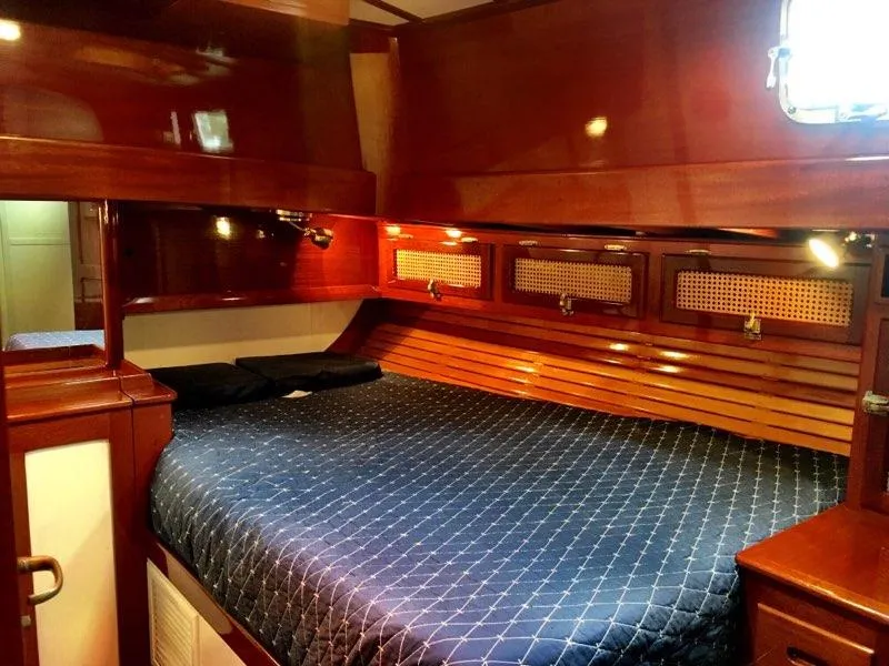 Slide: The Image of Luxurious cabin interior of 2000 Cherubini Schooner with polished wood and cozy bedding. - 30