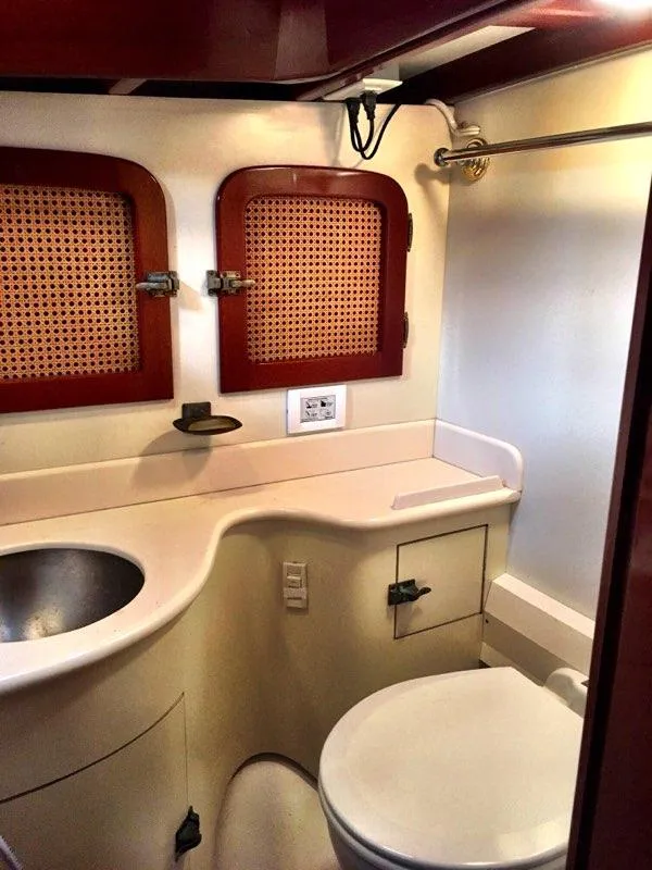 Slide: The Image of 2000 Cherubini Schooner bathroom with sink, toilet, and wooden accents. - 35