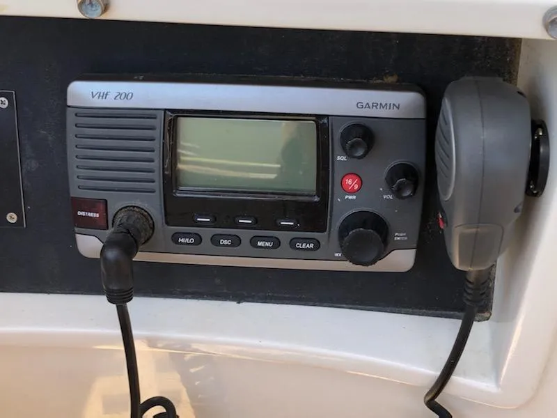 Slide: The Image of VHF 200 Garmin radio on 2000 Cherubini Schooner, featuring microphone and control panel. - 39