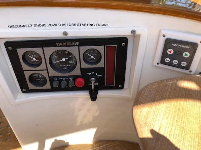 Slide: The Image of Control panel of a 2000 Cherubini Schooner with Yanmar engine gauges and shore power warning. - 40
