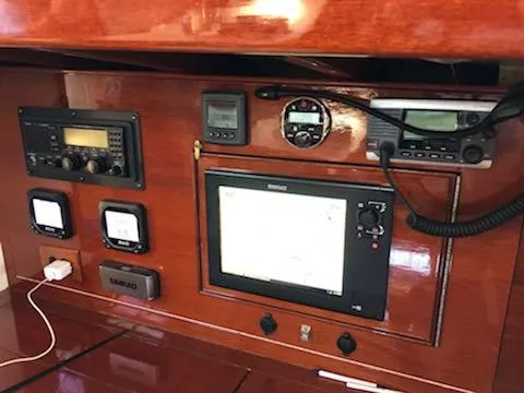 Slide: The Image of Navigation equipment on a 2000 Cherubini Schooner, featuring various control panels and displays. - 42