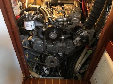 Slide: The Image of Engine room of a 2000 Cherubini Schooner, showcasing mechanical components and wiring. - 45