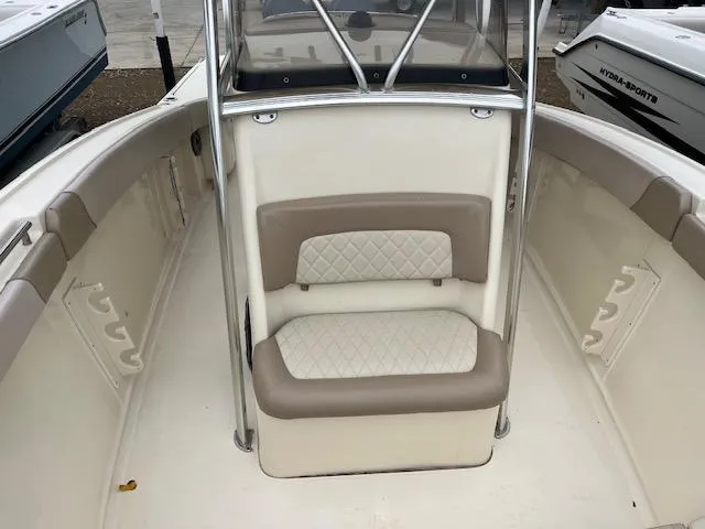 Slide: The Image of 2007 Scout 262 CC boat interior with cushioned seating and stainless steel railings. - 11