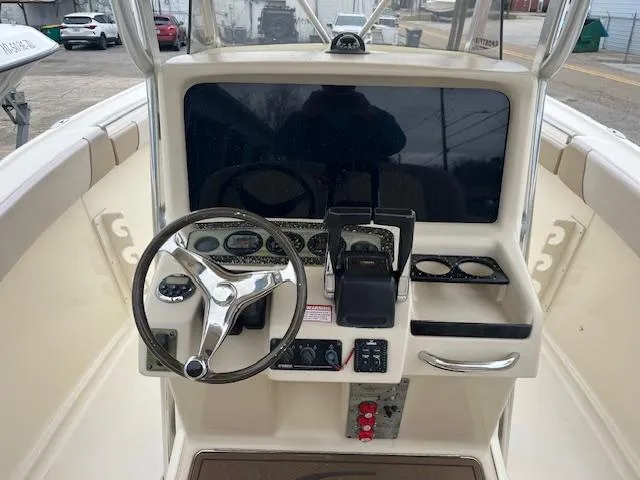 Slide: The Image of 2007 Scout 262 CC boat dashboard with steering wheel and control panel. - 5