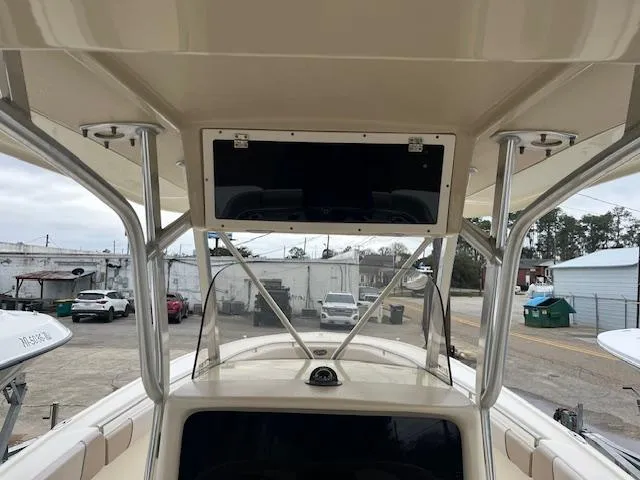 Slide: The Image of 2007 Scout 262 CC boat interior with T-top and console view. - 6