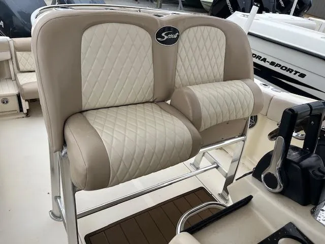 Slide: The Image of 2007 Scout 262 CC boat seats with beige and white diamond stitching. - 8