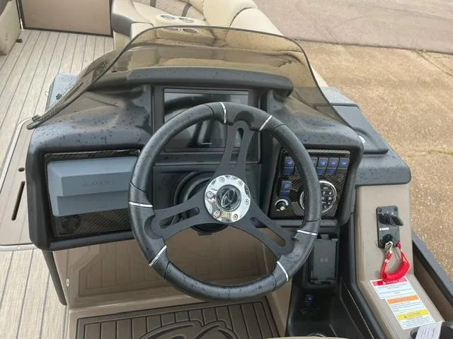 Slide: The Image of Steering console of 2025 Veranda PV25RCT boat with modern controls and dashboard. - 4