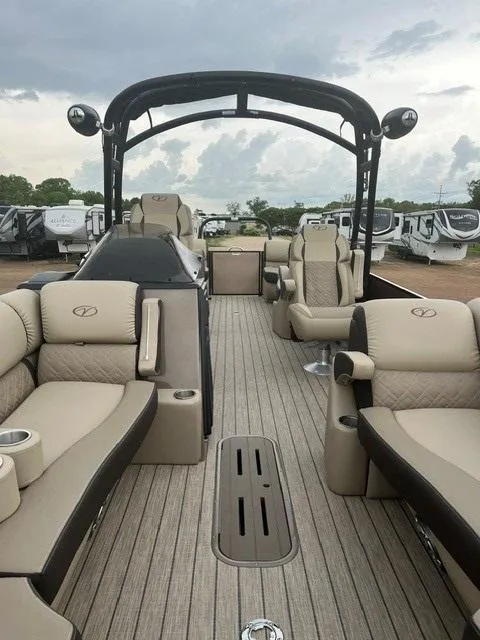 Slide: The Image of 2025 Veranda PV25RCT pontoon boat with luxurious seating and sleek design under cloudy skies. - 6
