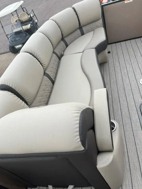 Slide: The Image of 2025 Veranda PV25RCT pontoon boat with luxurious beige seating and modern design. - 9