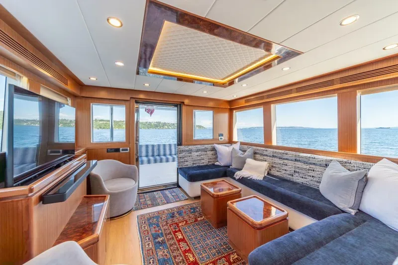 Slide: The Image of Luxurious interior of 2021 Apollonian Yachts 54 with elegant seating and panoramic windows. - 14