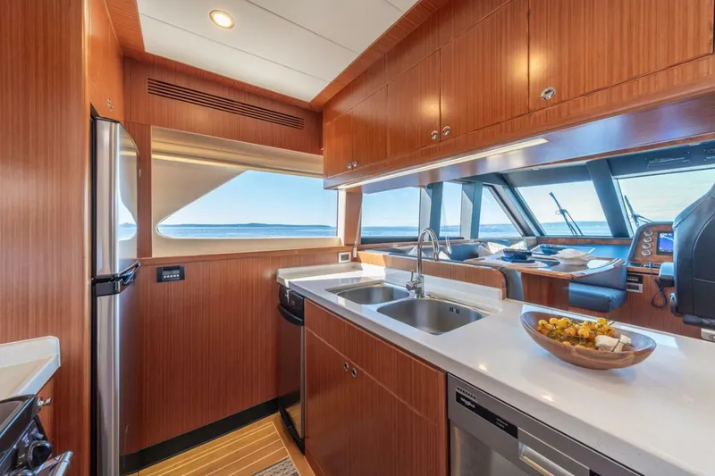Slide: The Image of Luxurious kitchen interior of 2021 Apollonian Yachts 54, featuring modern appliances and ocean view. - 15