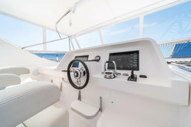 Slide: The Image of Helm of 2021 Apollonian Yachts 54, featuring modern navigation equipment and sleek design. - 39
