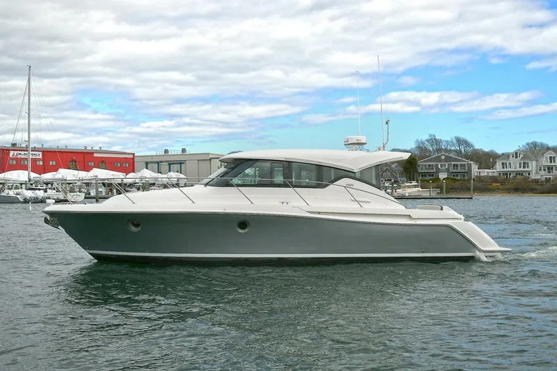 Slide: The Image of 2018 Tiara Yachts 39 Coupe cruising on a calm waterway. - 1