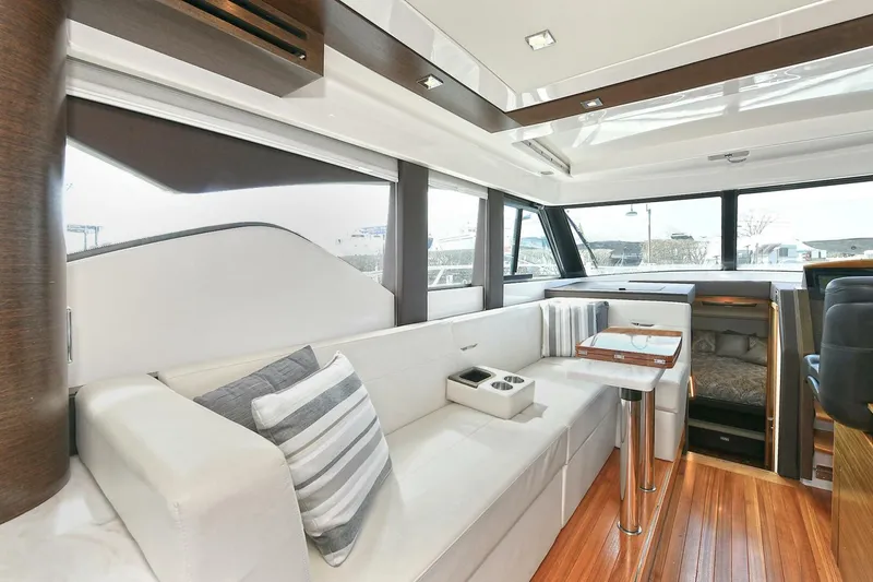 Slide: The Image of 2018 Tiara Yachts 39 Coupe interior with elegant seating and modern design. - 14