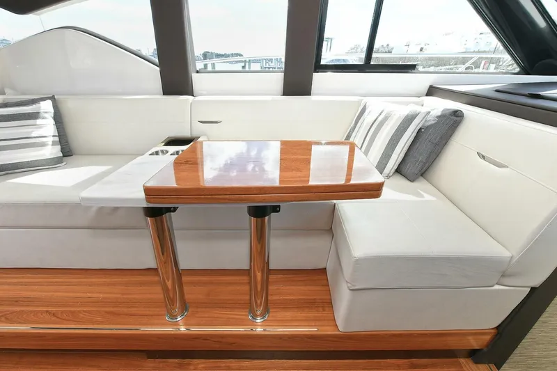 Slide: The Image of Luxurious interior of 2018 Tiara Yachts 39 Coupe with elegant seating and wooden table. - 17