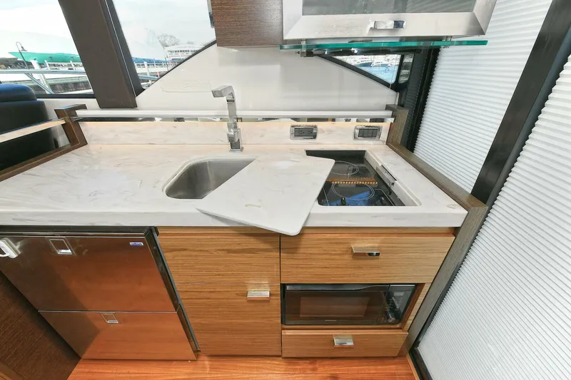 Slide: The Image of Modern kitchen area in 2018 Tiara Yachts 39 Coupe with sink and appliances. - 21