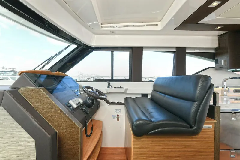 Slide: The Image of 2018 Tiara Yachts 39 Coupe interior with helm and leather seating. - 27