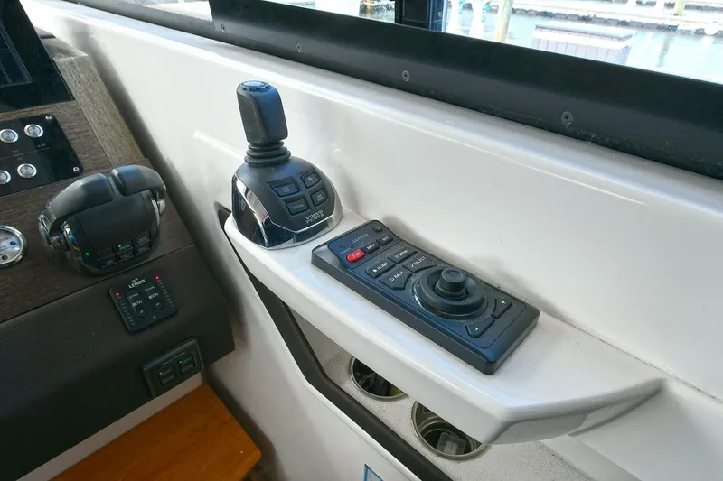 Slide: The Image of Control panel of 2018 Tiara Yachts 39 Coupe with joystick and navigation controls. - 28