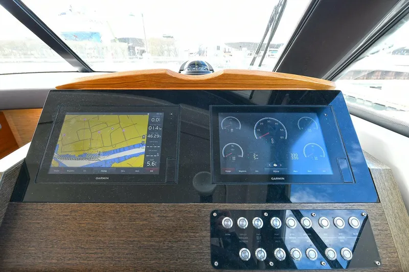 Slide: The Image of Helm of 2018 Tiara Yachts 39 Coupe with navigation and control displays. - 29